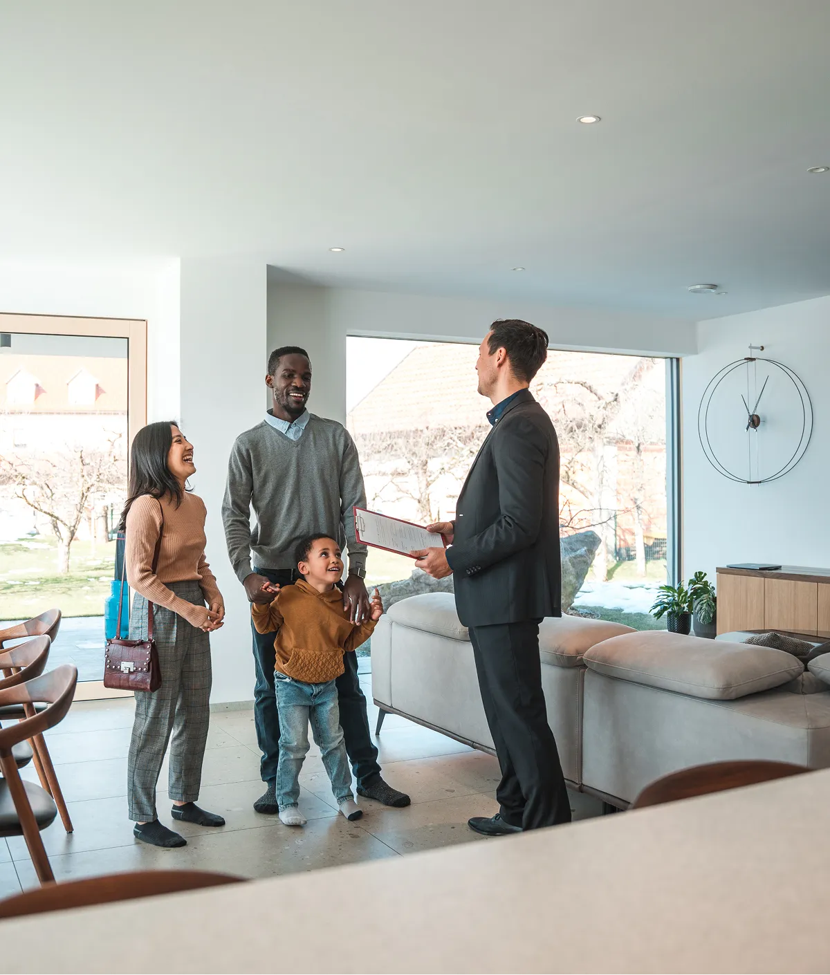 Family touring a modern living room